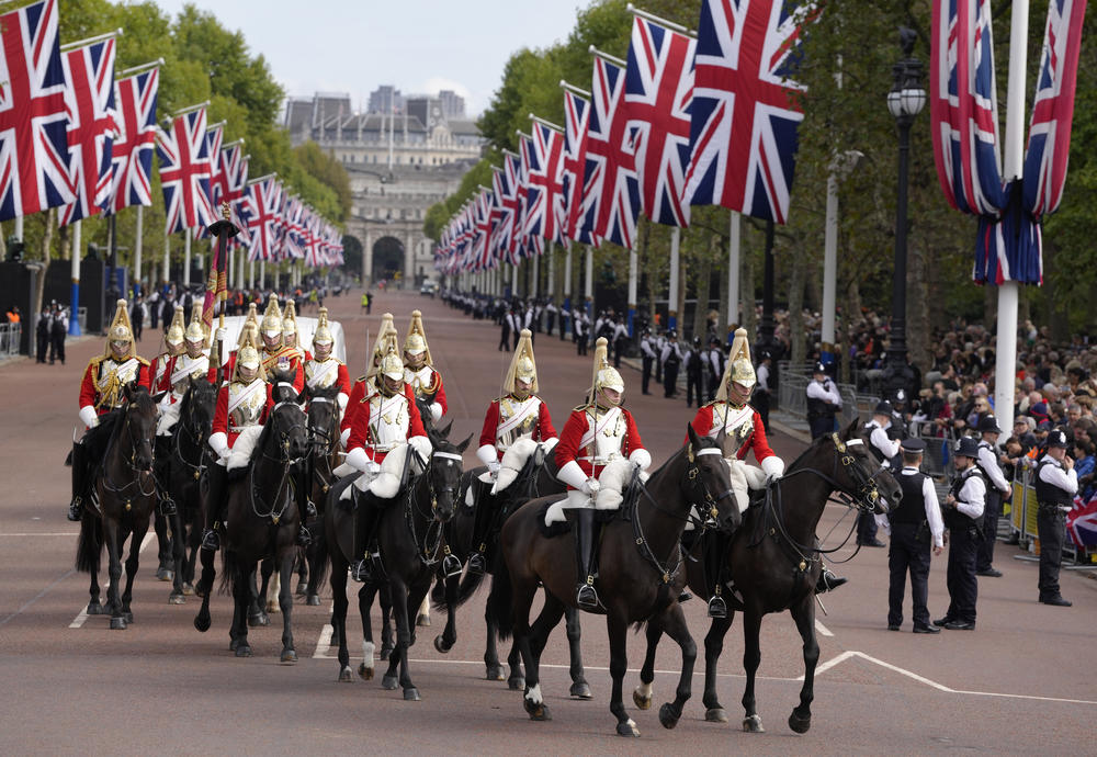 Mounted Household Cavalry ride along the route prior to the procession of the Gun Carriage which carried the coffin of Queen Elizabeth II from Buckingham Palace to Westminster Hall.