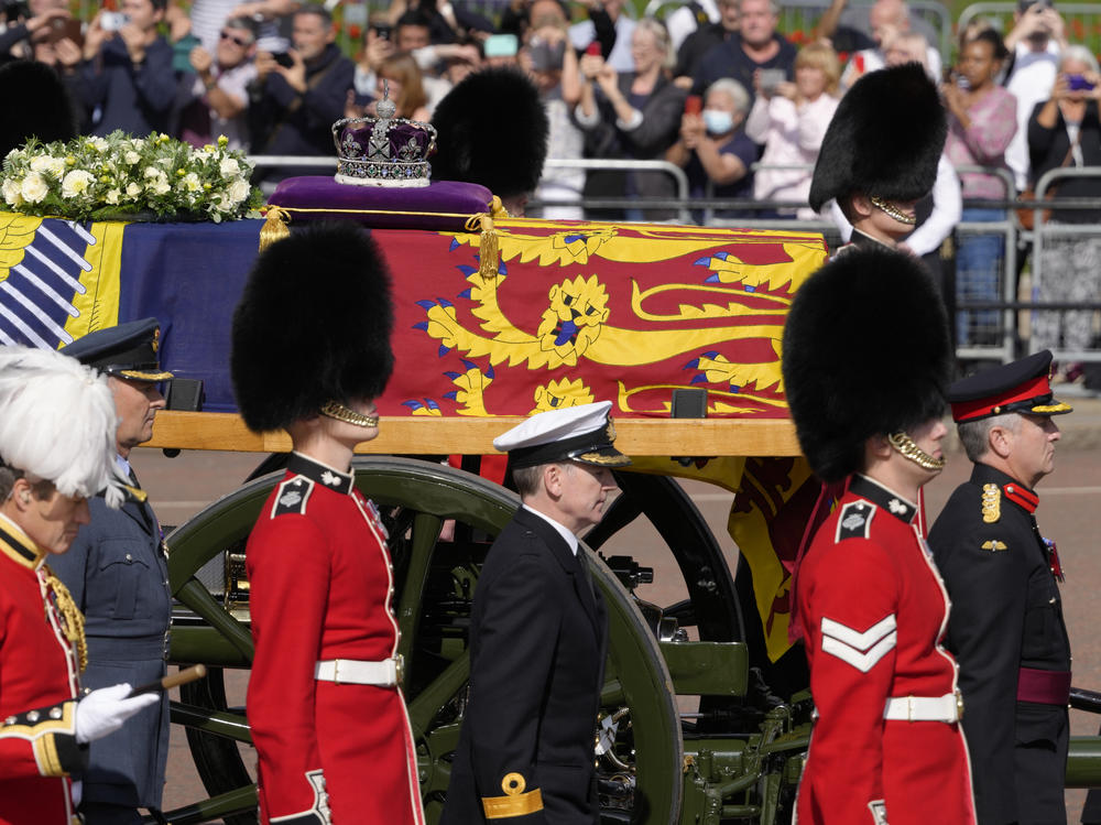 Grenadier Guards flank the coffin of Queen Elizabeth II during a procession from Buckingham Palace to Westminster Hall in London on Wednesday. The Queen will lie in state in Westminster Hall for four full days before her funeral on Monday.