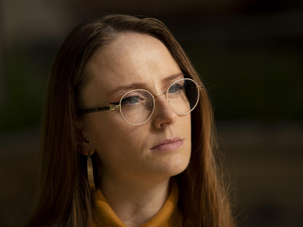 Charlotte Bennett, a former health policy aide to former Gov. Andrew Cuomo, pauses during an interview in New York on Oct. 12, 2021. Bennett sued Cuomo on Wednesday, saying he sexually harassed her then smeared her reputation.