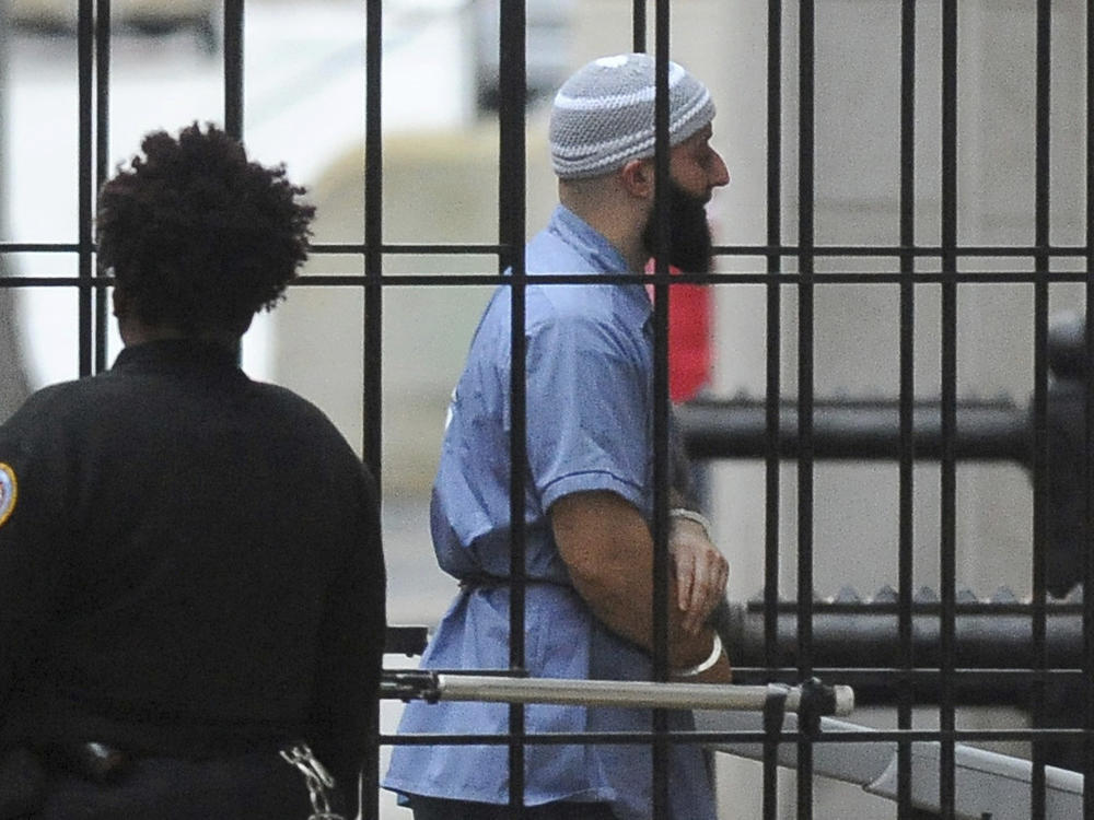 Adnan Syed enters a Baltimore courthouse prior to a hearing on Feb. 3, 2016. Baltimore prosecutors asked a judge on Wednesday to vacate his conviction for the 1999 murder of Hae Min Lee — a case that was chronicled in the hit podcast 