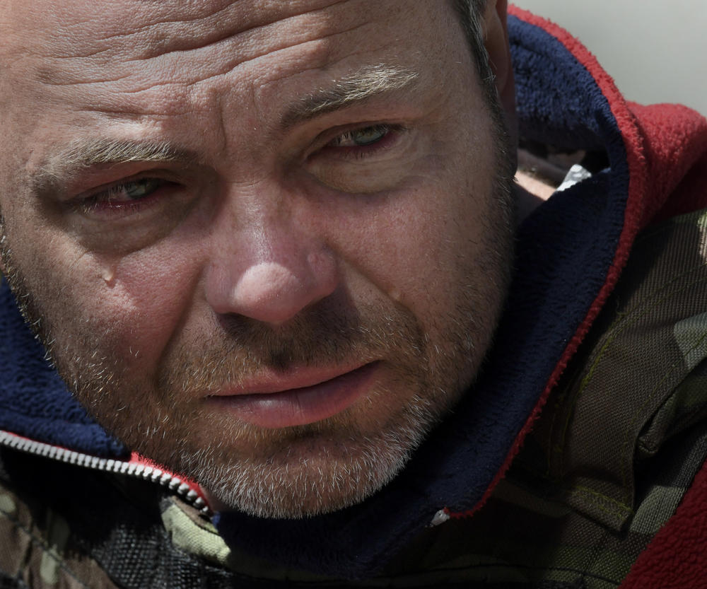 Zoo worker Serhii Kolesnikov cries after learning of the death of Denis Selevin, a 15-year-old volunteer at Feldman Ecopark who was killed by Russian shelling as rescuers were evacuating animals from the park, at a hospital in Kharkiv on May 5.