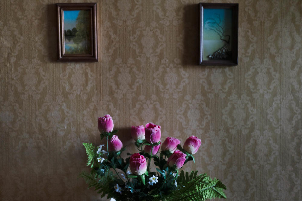 Artificial flowers adorn Larisa's apartment.