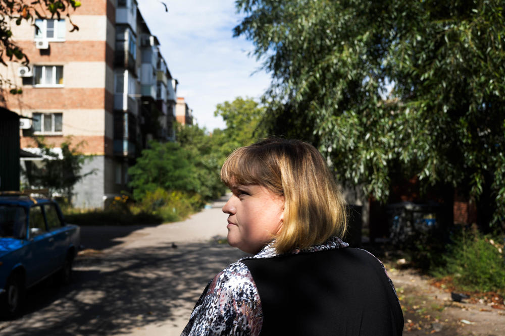 Svitlana Domoratska, a social worker in Sloviansk, walks through the city to visit older, homebound residents.