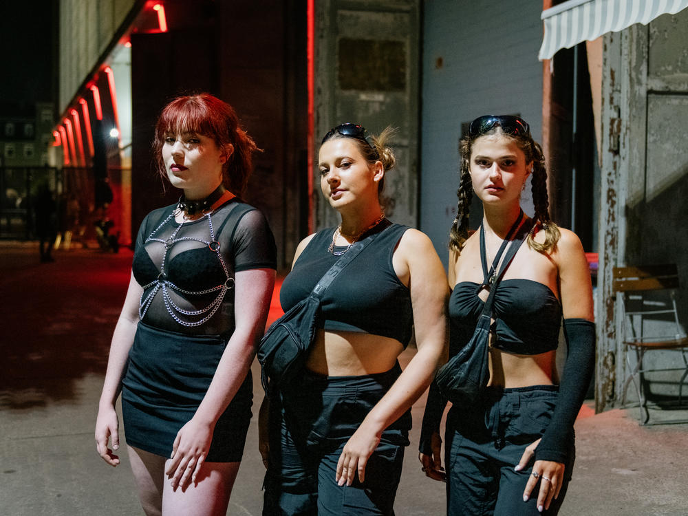 From left: Philippa, 23, from Sydney, Australia; Laura, 23, from Melbourne; and Isabella, 23, from Sydney wait in line to enter Tresor, one of Germany's popular nightclubs for electronic music, in Berlin in the early morning hours of Sept. 4.