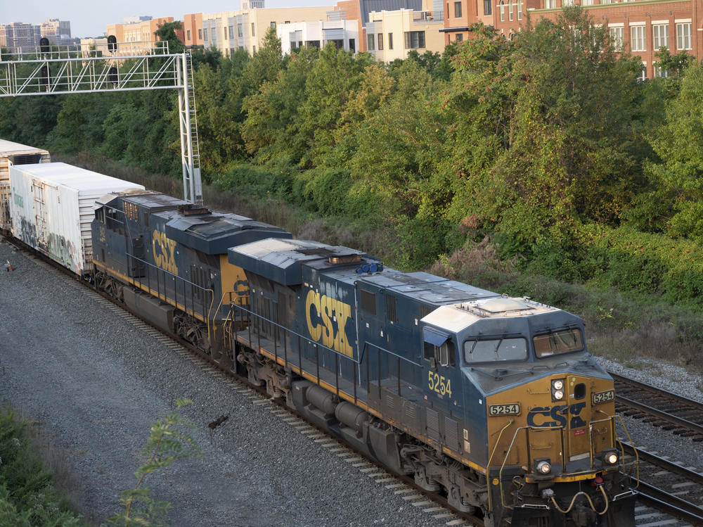 A tentative deal announced Thursday would avert a strike on the nation's freight lines with the potential to throw supply chains into chaos. Above, a CSX freight train travels through Alexandria, Va.