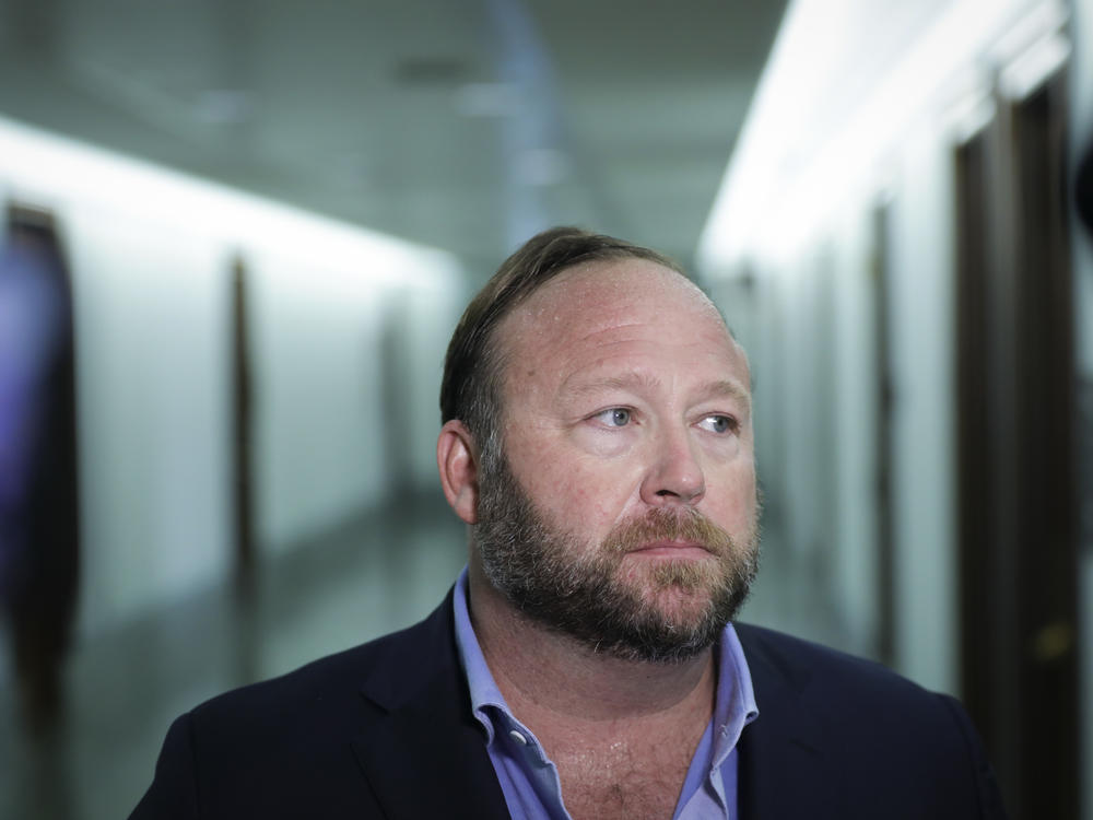 Conspiracy theorist Alex Jones, seen here in 2018, and his network of websites have been banned from most major online and social media platforms but have still managed to bring in tens of millions of dollars in revenue.