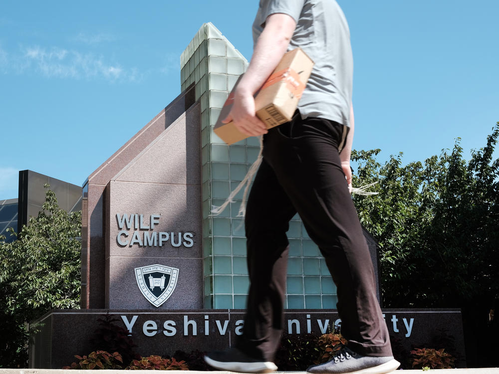 People walk by the campus of Yeshiva University in New York City on Aug. 30. A Supreme Court ruling left in place a New York state court ruling requiring the university to recognize the YU Pride Alliance.