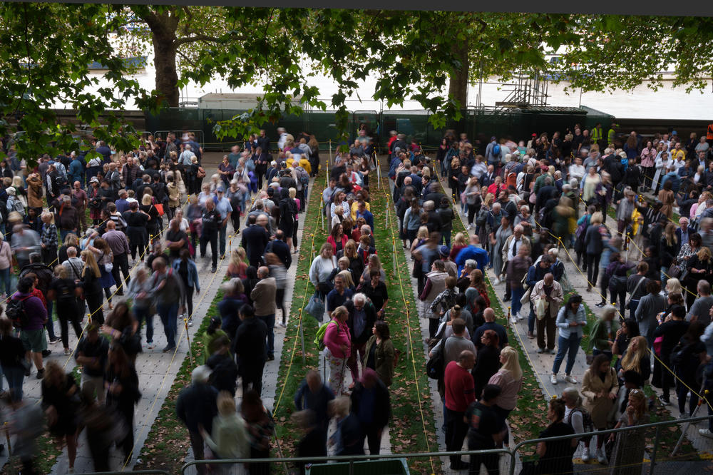 Members of the public wait in line to pay their respects to Queen Elizabeth II as she lays in state within Westminster Hall.