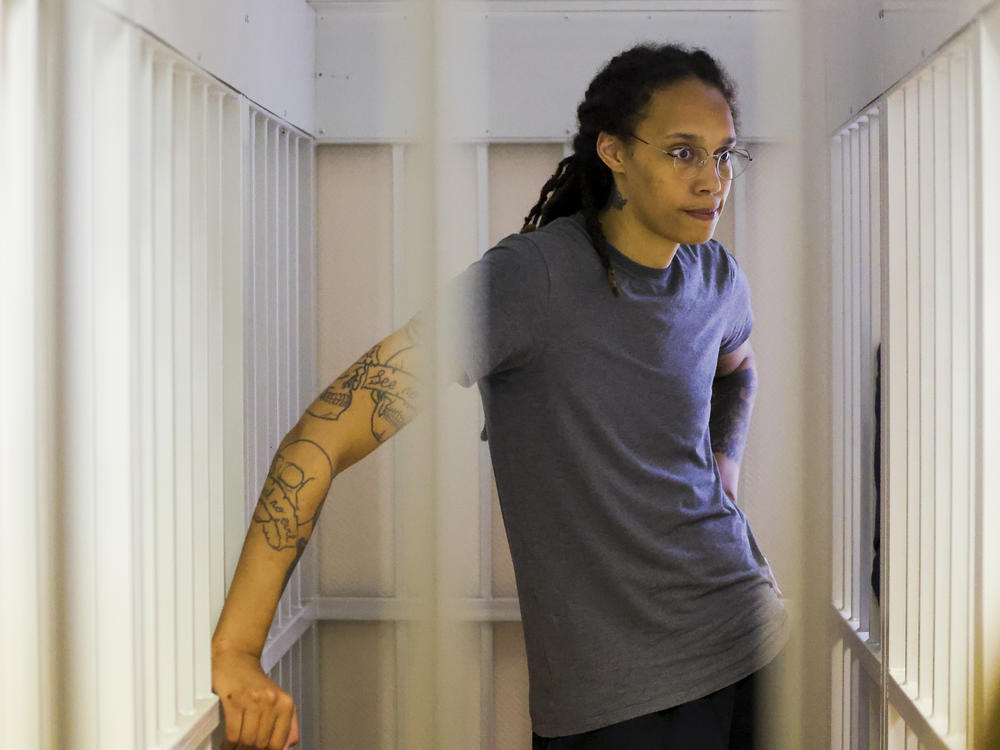 WNBA star and two-time Olympic gold medalist Brittney Griner stands listening to a verdict in a courtroom in Khimki just outside Moscow, Russia, on Aug. 4. Griner apologized to her family and teams as a Russian court heard closing arguments in her drug possession trial.