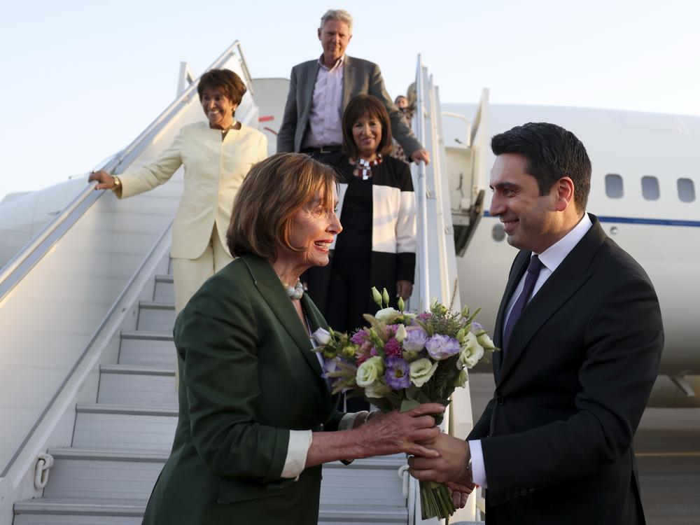 In this handout photo released by Armenian National Assembly via Photolure photo agency, Head of Armenian National Assembly Alen Simonyan, right, welcomes U.S. House of Representatives Nancy Pelosi upon her arrival at the International Airport outside of Yerevan, Armenia, Saturday, Sept. 17, 2022.