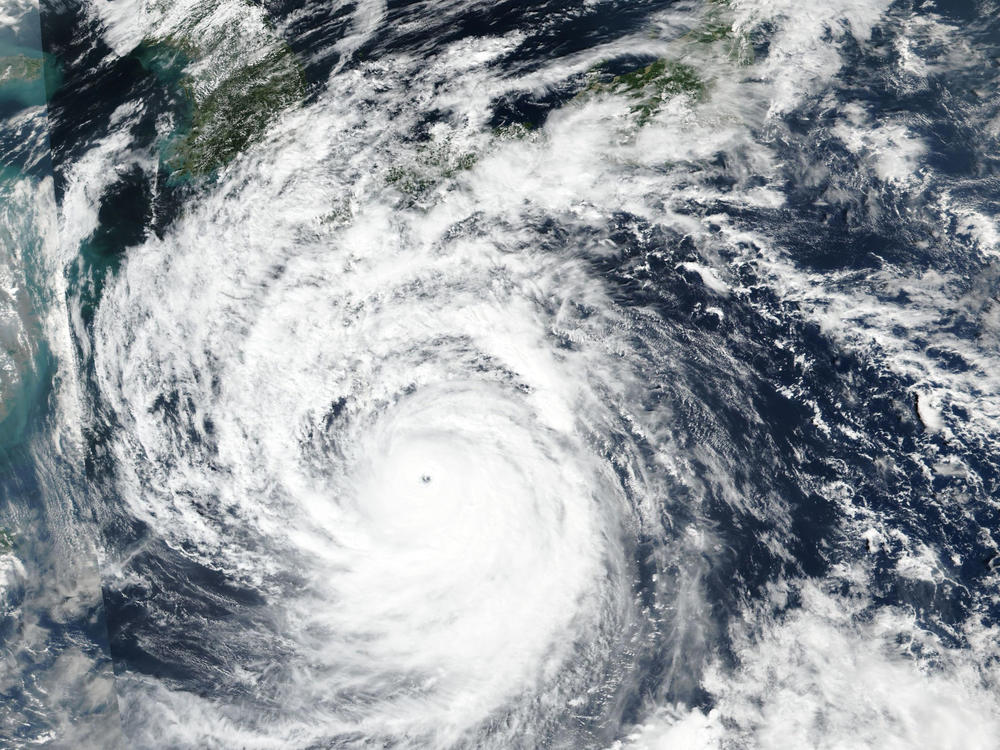This Saturday, Sept. 17, 2022 satellite image released by NASA shows Typhoon Nanmadol, which is approaching southwest Japan. (NASA Worldview, Earth Observing System Data and Information System (EOSDIS) via AP)