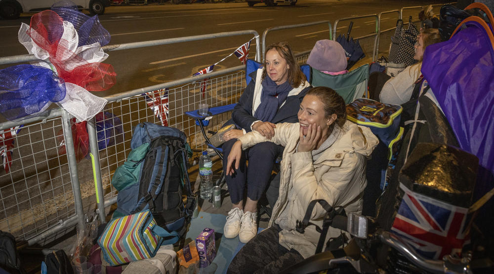 Rosie Johnson and her daughter Ella Johnson camp overnight outside of Westminster Hall and the houses of Parliament in London.