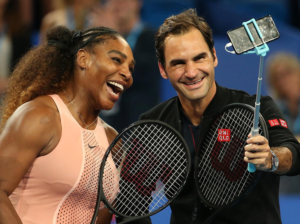 Serena Williams and Roger Federer take a selfie following their mixed doubles match on Jan. 1, 2019, in Perth, Australia.