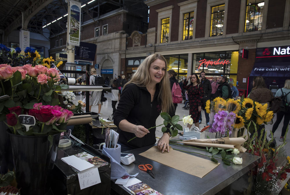 Loreta Mujaj sells flowers in Victoria station in London on Saturday.
