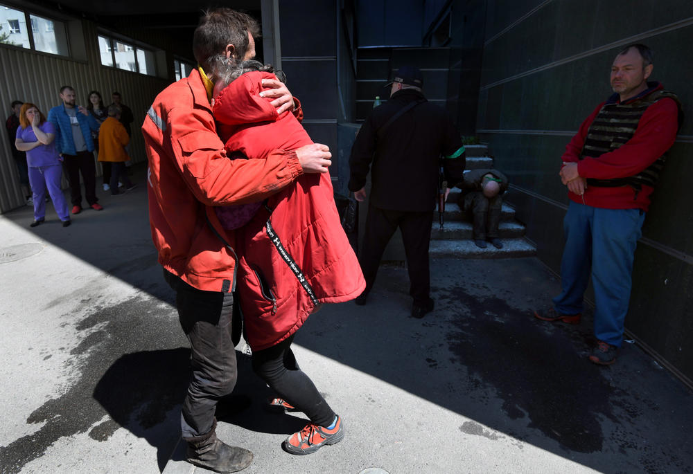 Svetlana Selevina and Vitalii Selevin embrace after hearing the news of the death of their son, Denis Selevin, at a hospital in Kharkiv on May 5.