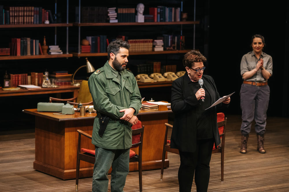 Andhy Mendez as Fidel Castro takes the stage next to director Molly Smith for the opening night - and closing night - of the play <em>Celia and Fidel</em> at Arena Stage in Washington, D.C.