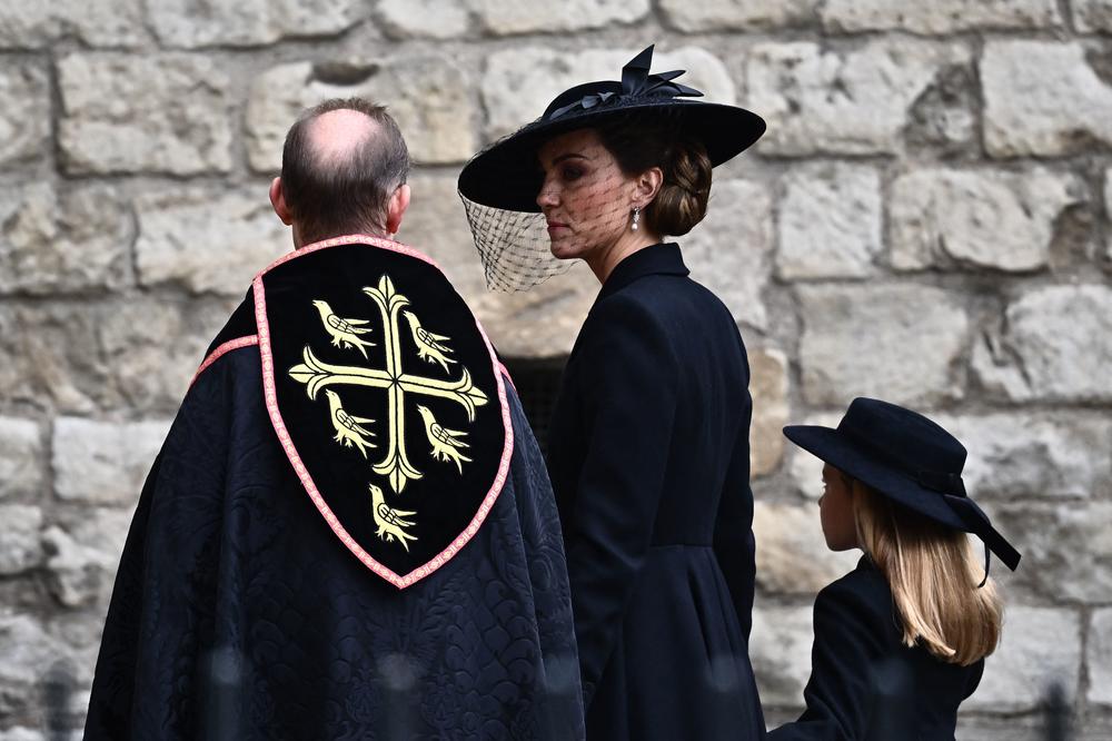 Britain's Catherine, Princess of Wales (C) and Britain's Princess Charlotte of Wales arrive at Westminster Abbey.