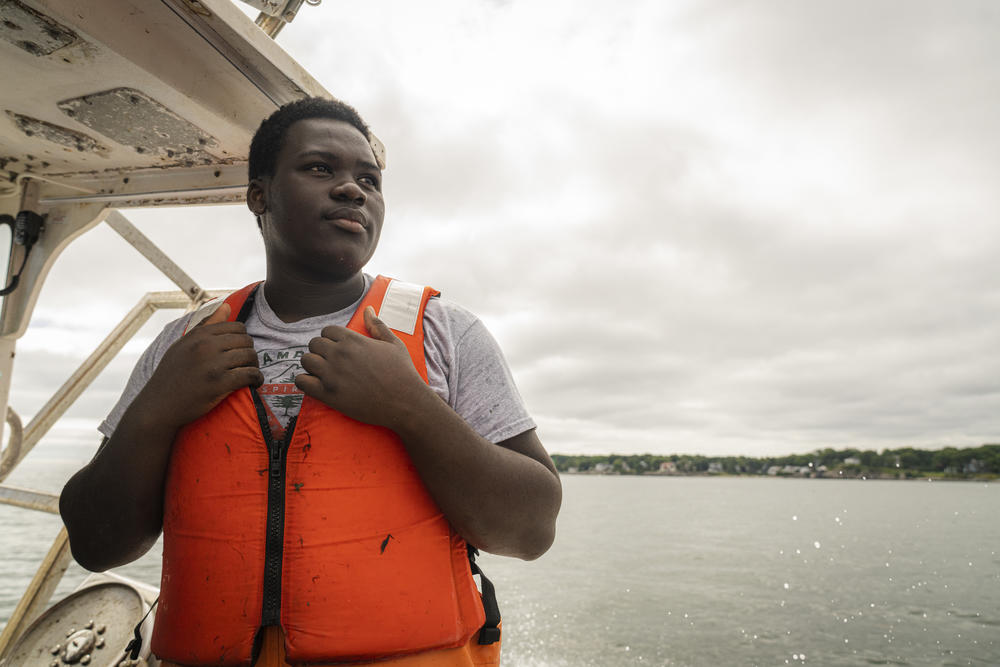 High school student Cris Silva, 15, has been learning to lobster aboard the Sea Smoke lobster boat in Portland, Maine.