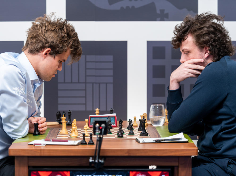 Magnus Carlsen (left) and Hans Niemann face off at the Sinquefield Cup in St. Louis on Sept. 4. The two had a rematch on Monday, but Carlsen only played one move before resigning from the game.