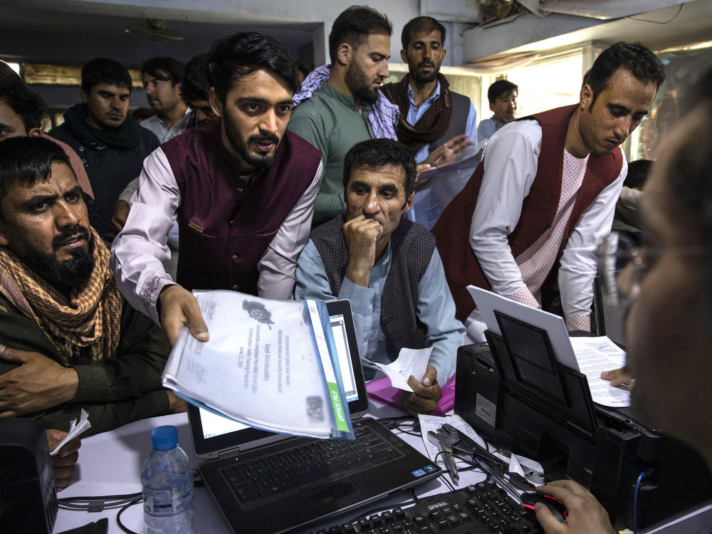 Afghan Special Immigrant Visa applicants crowd into the Herat Kabul Internet cafe, seeking help applying for the SIV program on Aug. 8, 2021, in Kabul, Afghanistan. The Taliban took over Afghanistan a week later. More than 74,000 applicants remain in the backlog of the SIV program, designed to help those who served the U.S. overseas.