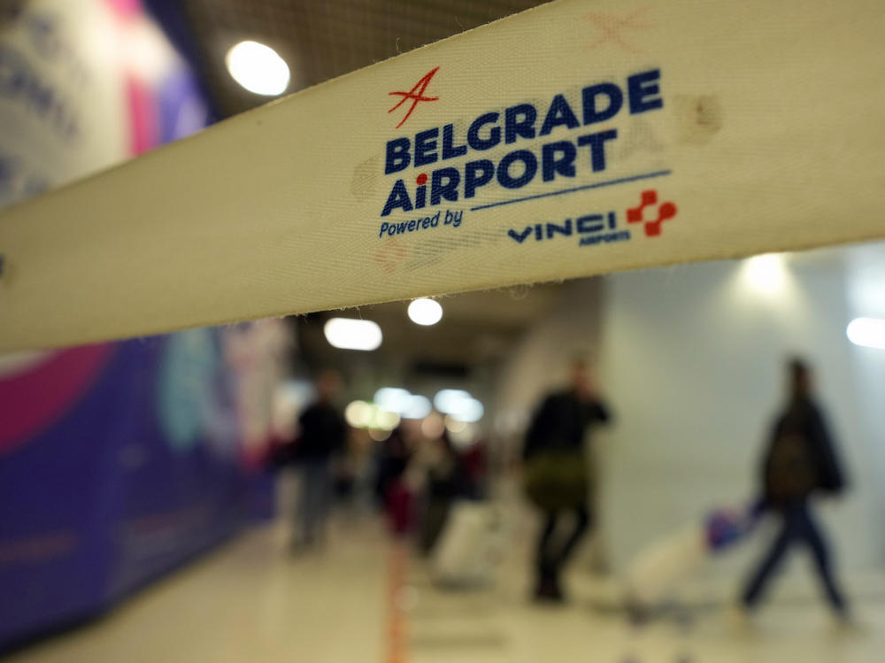 Passengers from the Moscow-Belgrade flight, operated by Air Serbia, pass through the airport in Belgrade, Serbia, on Wednesday.