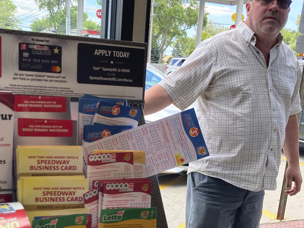 A customer walks in to the Speedway gas station in Des Plaines, Ill., where the winning Mega Millions lottery ticket was sold on July 30. Two people who wish to remain anonymous have claimed the $1.337 billion jackpot, officials said Wednesday.