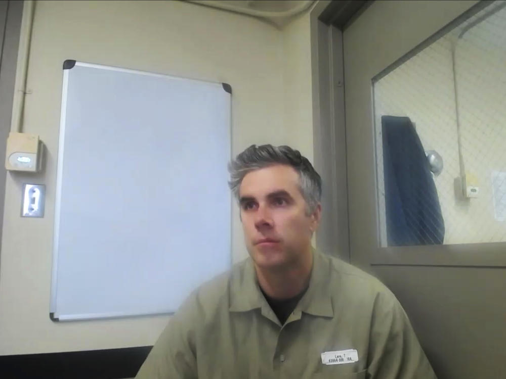 In this image from video, former Minneapolis Police Officer Thomas Lane listens on Wednesday from the Federal Correctional Institution Englewood in Colorado during a hearing. He was sentenced to three years for aiding and abetting second-degree manslaughter in the killing of George Floyd.