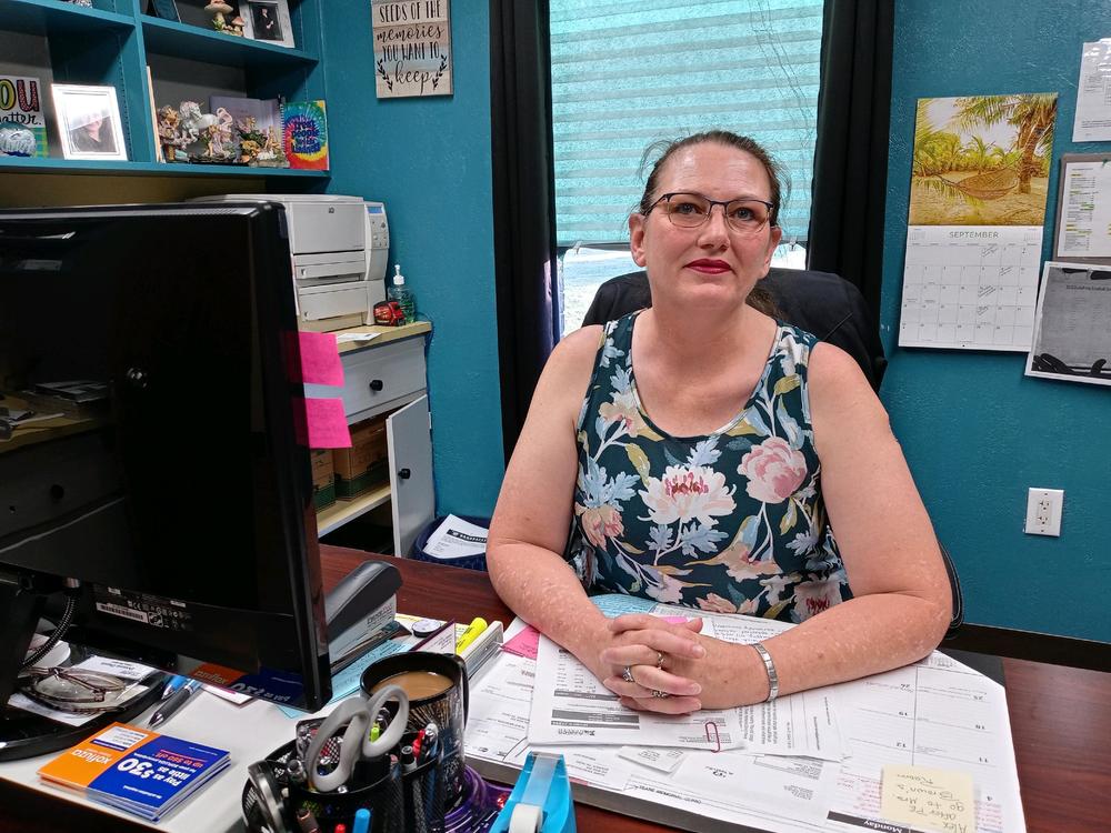 Donna Dunn, 49, works as the office manager at a healthcare clinic in Booker, Texas. Despite getting a raise, she has struggled to pay her family's bills as prices have risen faster than her paycheck.