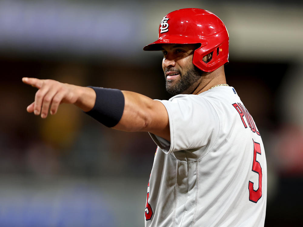 Albert Pujols of the St. Louis Cardinals points to the San Diego Padres dugout after hitting a single during the ninth inning of Tuesday night's game in San Diego. He ended the night with two singles, a walk and no home runs.
