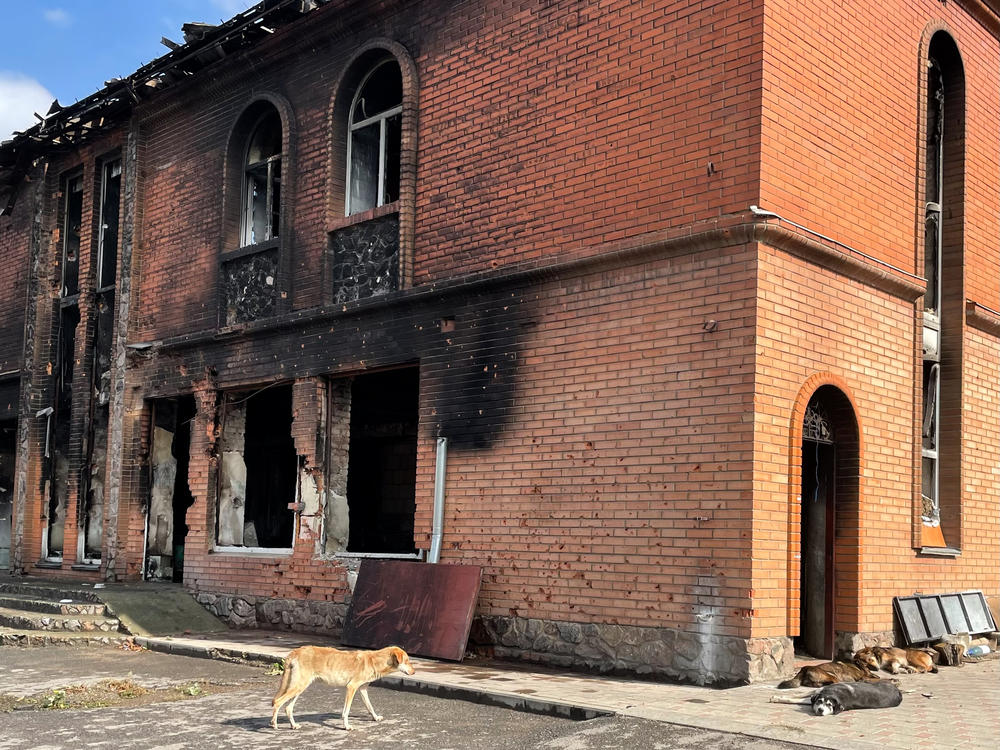 A building that was destroyed during the initial offensive by Russian troops in February on the main street in Kozacha Lopan on Sunday. Residents say Russian soldiers used the building as a base during the occupation of the border town.