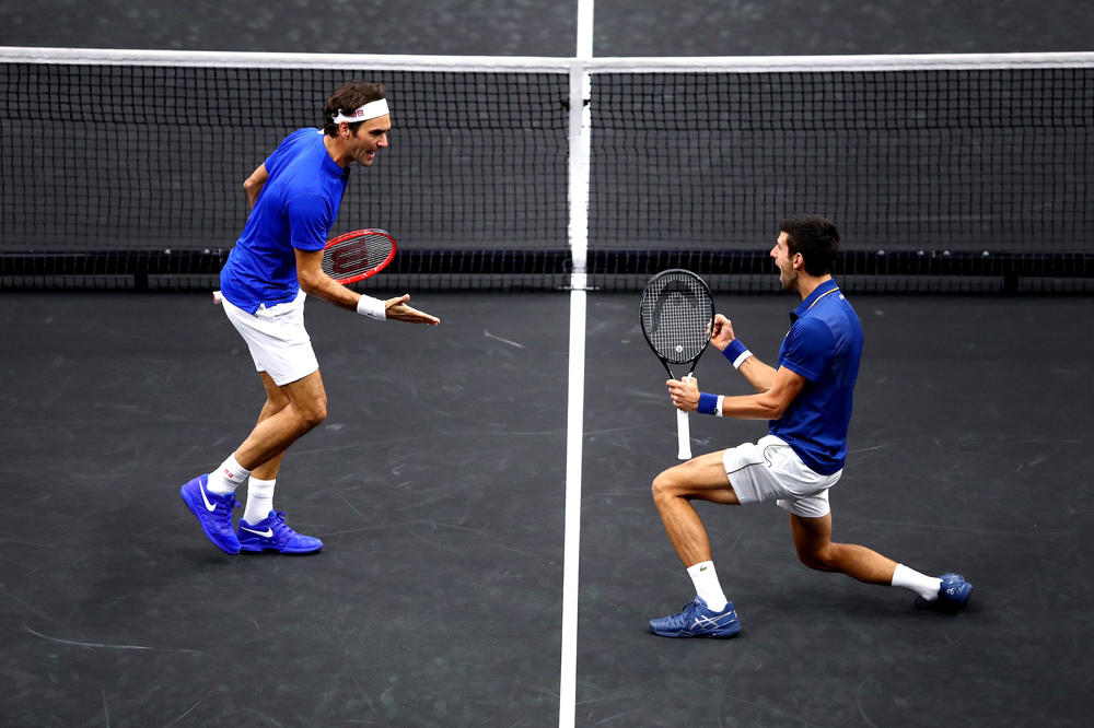 Roger Federer, left, and Novak Djokovic celebrate a point at the Laver Cup in Chicago, Ill., in September 2018.