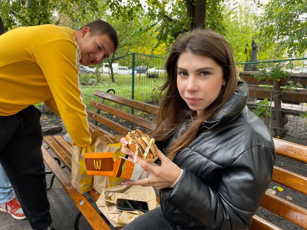 Yaroslav Holovatenko (left) and a friend with their McDonald's meals in Kyiv on Wednesday.