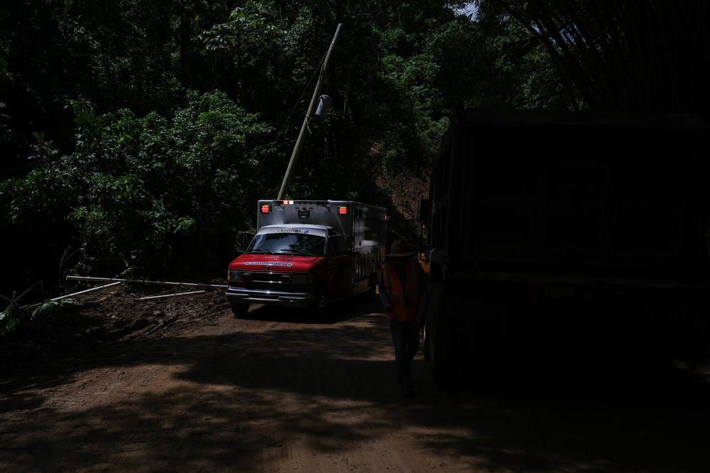 Four days after Hurricane Fiona struck Puerto Rico, it's still slow going through many parts of the island. First responders drive carefully through state route 155 that runs from Coamo to Vega Baja through Orocovis and Morovis that is currently being cleared after landslides blocked access.
