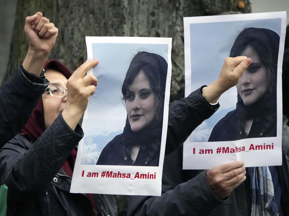 Protesters gather in front of the embassy of Iran in Berlin, on Tuesday after the death of 22-year-old Mahsa Amini in the custody of Iran's morality police.
