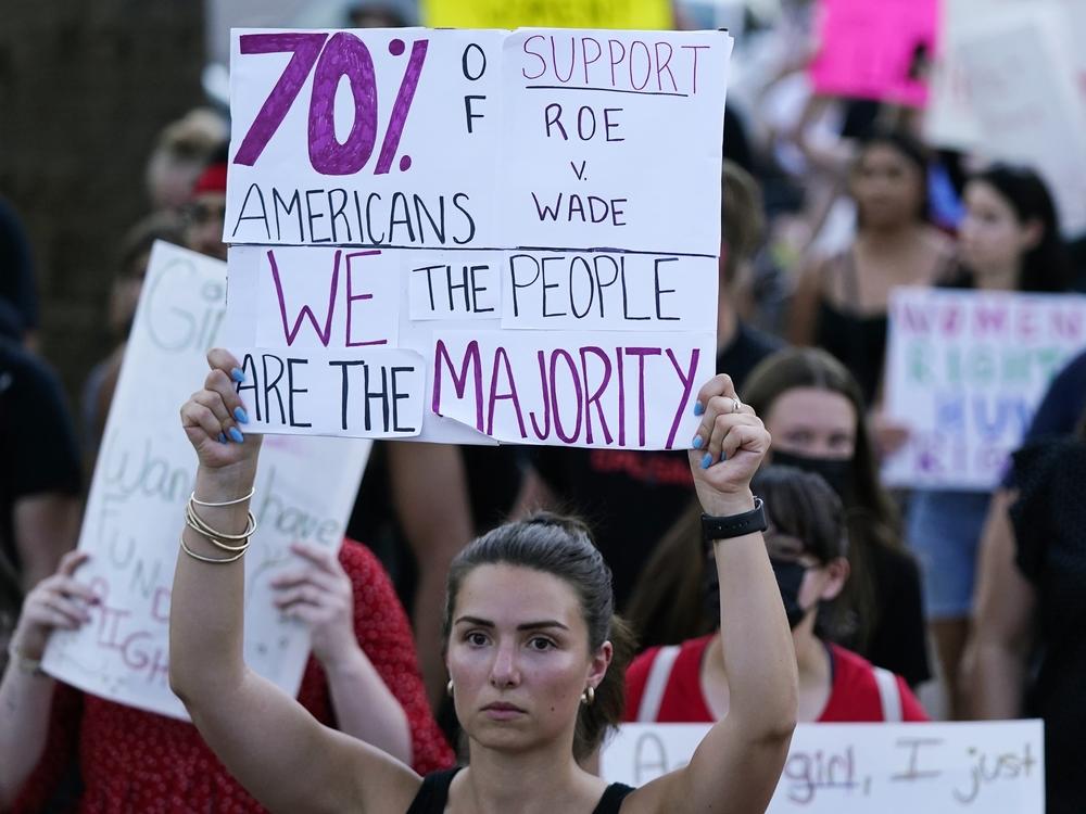 Protesters march around the Arizona Capitol in Phoenix after the Supreme Court decision to overturn Roe v. Wade. A new Arizona law banning abortions after 15 weeks of pregnancy takes effect Saturday, Sept. 24.