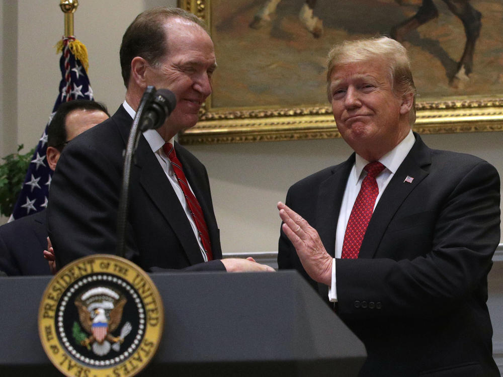 Former President Donald Trump shakes hands David Malpass on Feb. 6, 2019 after nominating him to lead the World Bank.