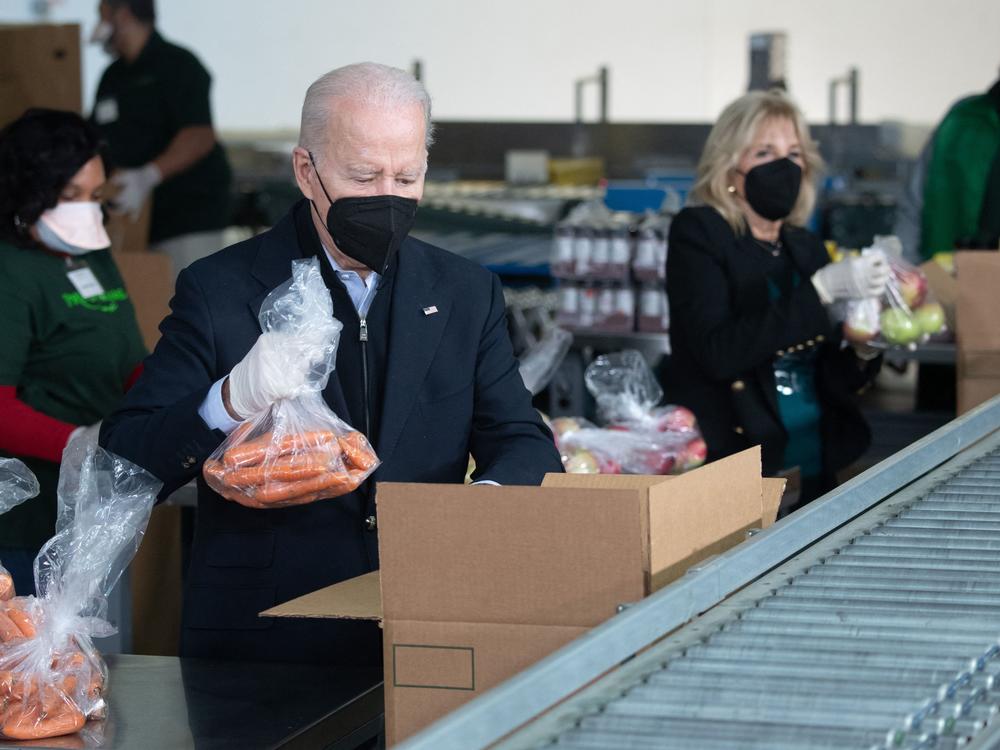 President Biden and first lady Jill Biden pack food boxes while volunteering on Martin Luther King, Jr., Day of Service in Philadelphia, Pennsylvania on Jan. 16, 2022.