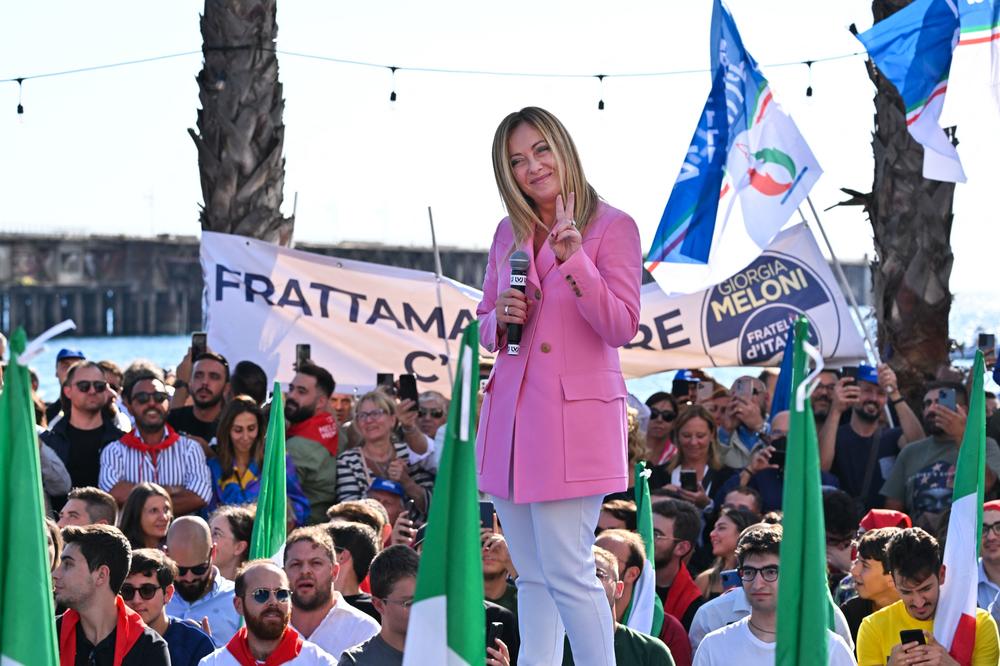 Giorgia Meloni, leader of Italian far-right party Fratelli d'Italia (Brothers of Italy), flashes the victory sign as she delivers a speech at the Arenile di Bagnoli beachfront in Naples on Friday, closing her party's campaign for the Sept. 25 general election.