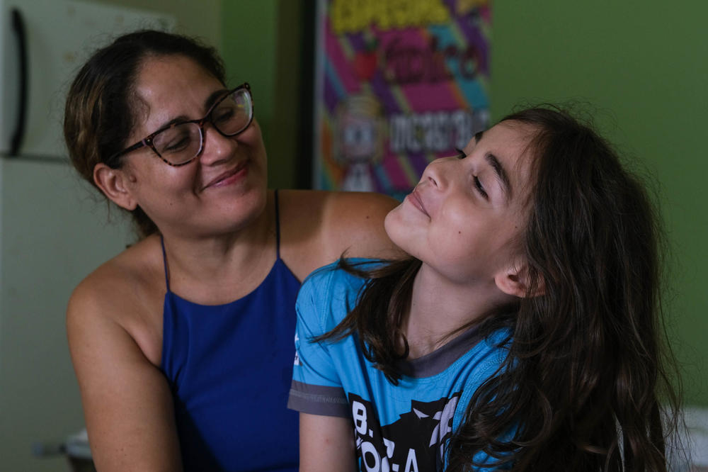 Carla Rolón Alvarado and her son Aldo Rodriguez at the refuge at the Carlos Colón Burgos High School, which hosts families and individuals from the communities of Salinas.