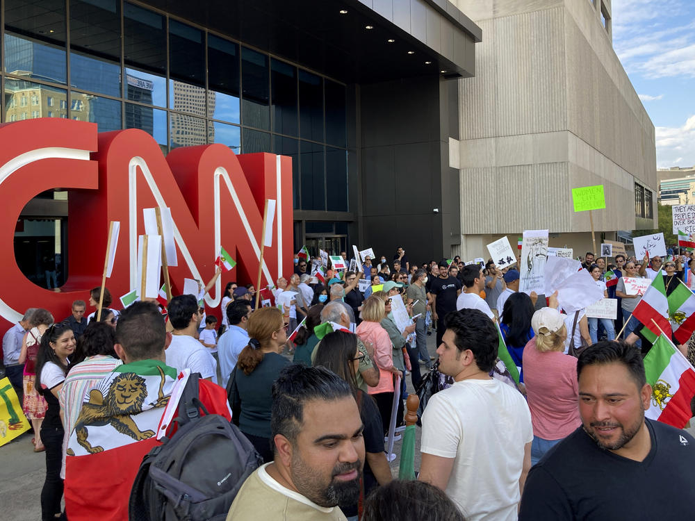 Iranian Americans demonstrate in support of protesters in Iran on Sunday in Atlanta. The demonstration comes amid violent unrest in Iran that was triggered by the death of a young woman in police custody.