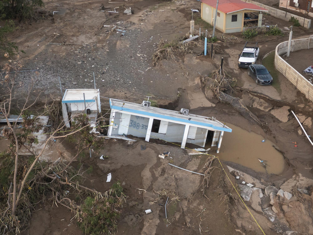 A house lays in the mud after it was washed away by Hurricane Fiona at Villa Esperanza in Salinas, Puerto Rico, Wednesday, Sept. 21, 2022.