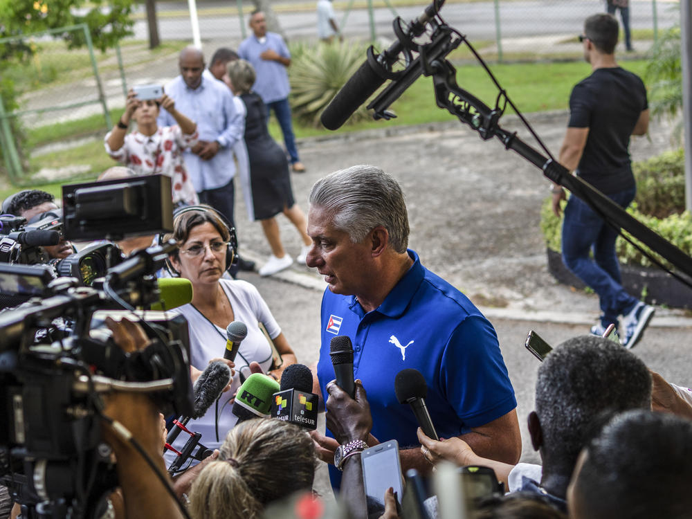 Cuba's President Miguel Díaz-Canel speaks to the press on Sunday after casting his vote at a polling station in Havana during the new family law referendum.