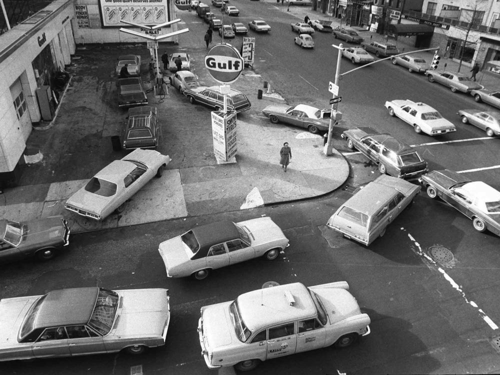 In this Dec. 23, 1973 file photo, cars line up in two directions at a gas station in New York City.