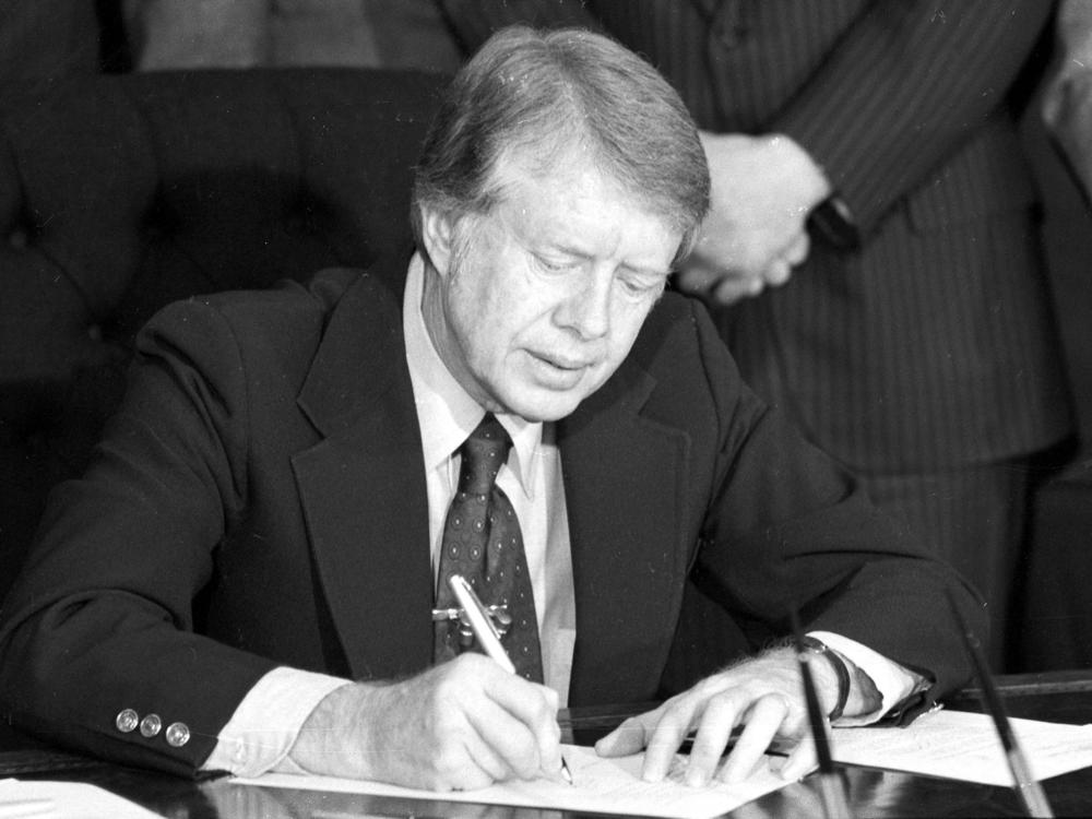 President Jimmy Carter signs an emergency natural gas legislation in the Oval Office of the White House in Washington, D.C., in 1977.