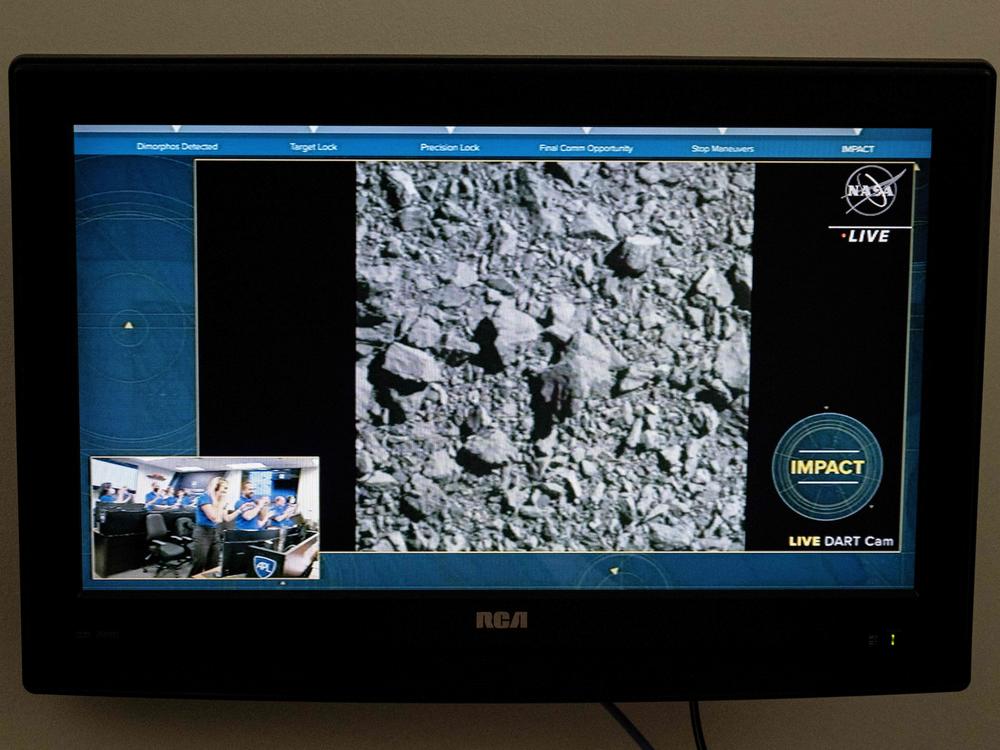 A TV screen at NASA's Kennedy Space Center in Cape Canaveral, Fla., captures the last images from the Double Asteroid Redirection Test (DART) as it smashes into the asteroid Dimorphos on Monday.
