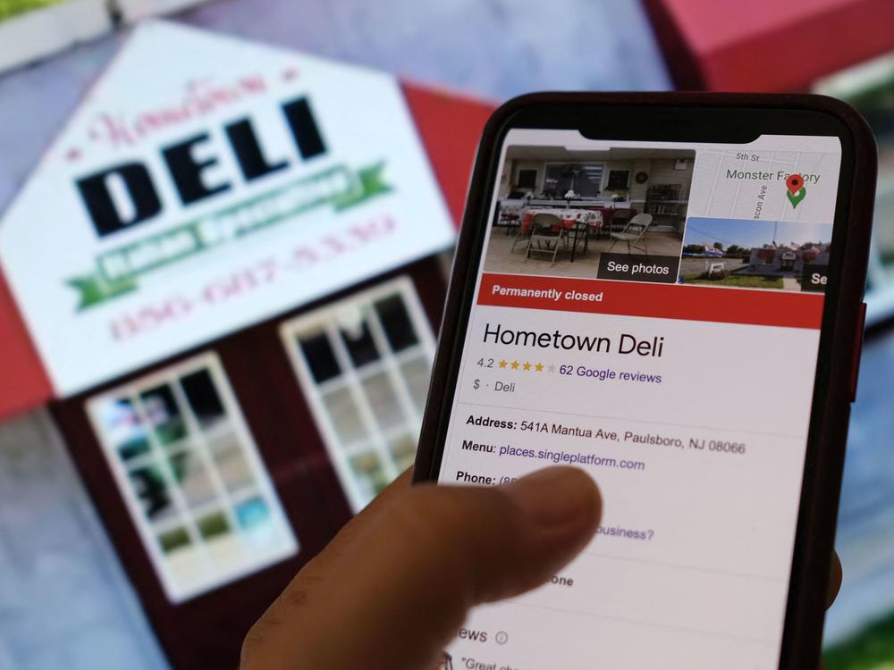 U.S. officials have announced fraud charges against three men who, they allege, orchestrated a scheme to inflate the market value of the company that owned Hometown Deli, a small delicatessen in New Jersey. In this photo illustration, a person views online information for the now-shuttered deli.