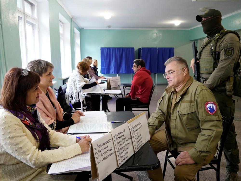 Konstantin Ivashchenko, former CEO of the Azovmash plant and appointed pro-Russian mayor of Mariupol, visits a polling station as people vote in a referendum in Mariupol on Tuesday.