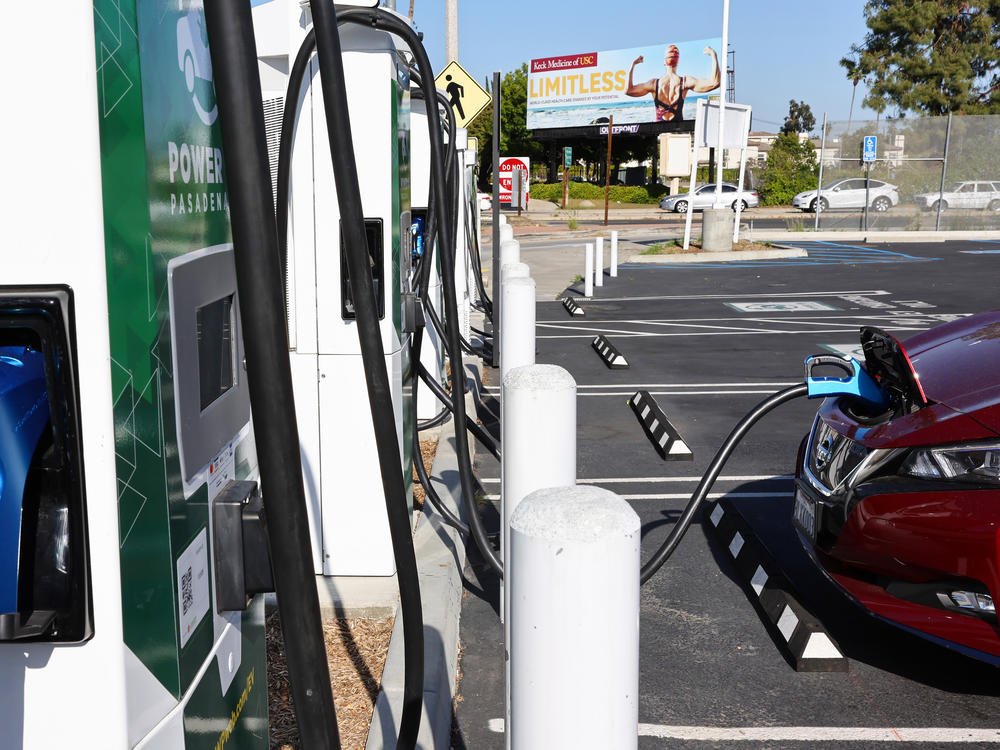 A Nissan electric vehicle recharges at a Power Up fast charger station on April 14, 2022, in Pasadena, Calif. California has more chargers than any other state in the U.S., but the federal government is trying to expand charger access across the country.