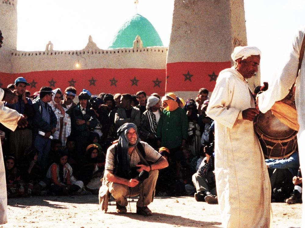 Metzner pictured recording Sufi musicians in Morocco.