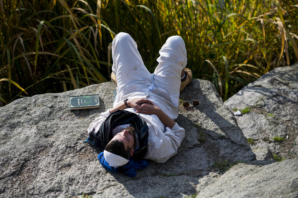 A man rests during the annual Rosh Hashanah pilgrimage to Rabbi Nachman's tomb in Uman on Monday.